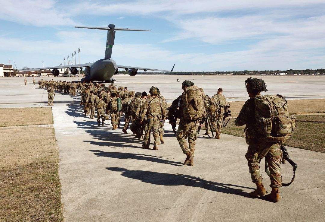 U.S. Army paratroopers of an immediate reaction force from the 82nd Airborne Division leave Fort Bragg